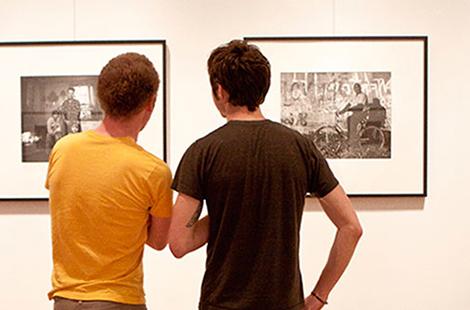 People looking at paintings