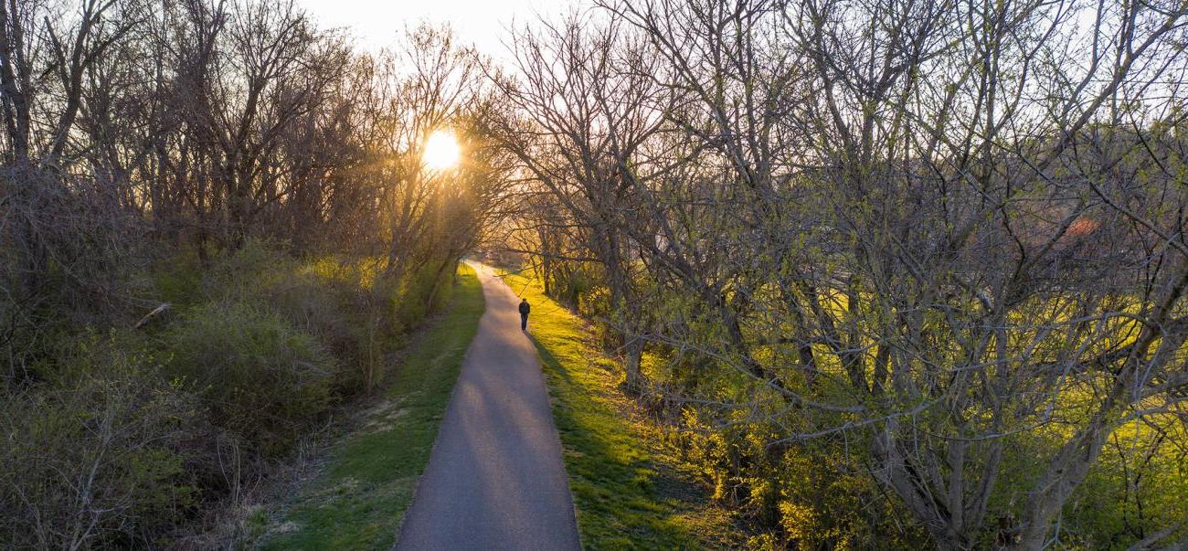 Someone walks on the bike path at sunset in 雅典, Ohio